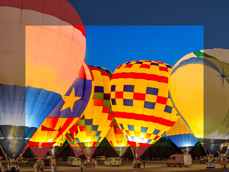 Description: Colorful hot air balloons are on display. The center side is more colorful and has depth compared to the edges. 