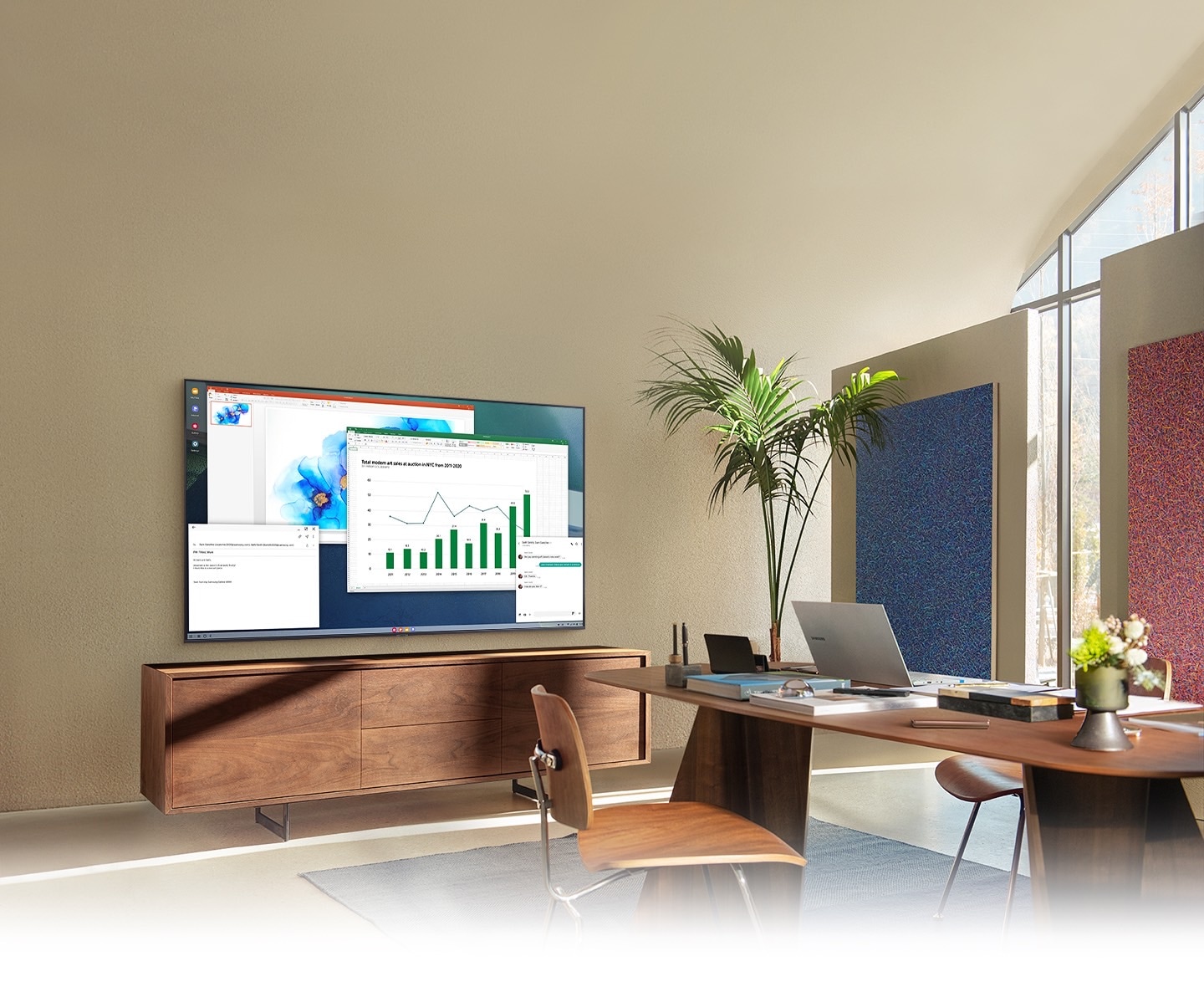 Description: In a living room home office, A TV screen shows PC on TV feature which allows home TV to connect to office PC.