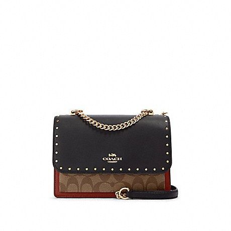 klare crossbody in signature canvas with rivets
