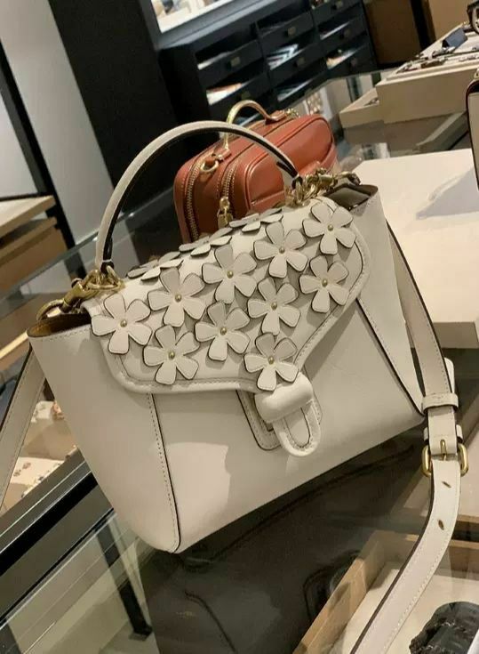 coach courier carryall 23 with floral applique