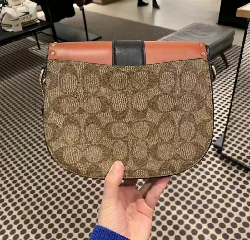 georgie saddle bolsa in colorblock signature canvas with rivets