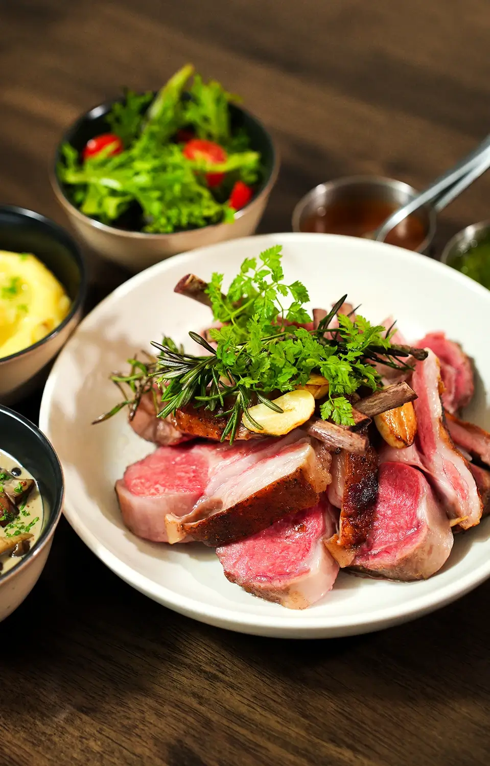 Cooked New Zealand Lumina Lamb Frenched Rack served at Grind & Ground