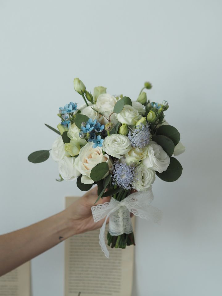 White roses with eustoma and trachymene bridal hand bouquet - RM298