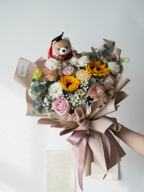 mix it with pink roses and sunflower, together with hana and baby breath with ping pong and foliage (medium size) with bear - RM258