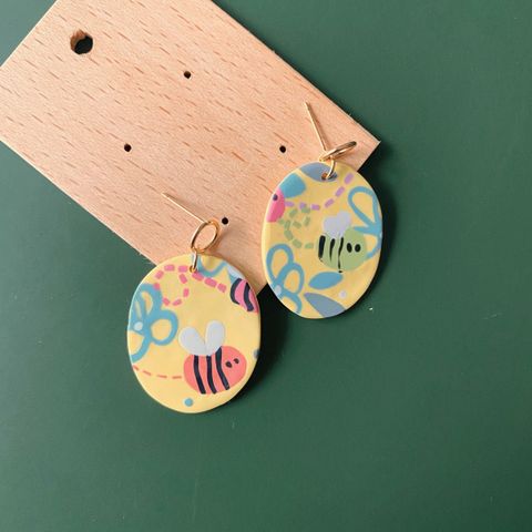 032-2 Bee The Hustler Oval Dangle Earrings.jpg
