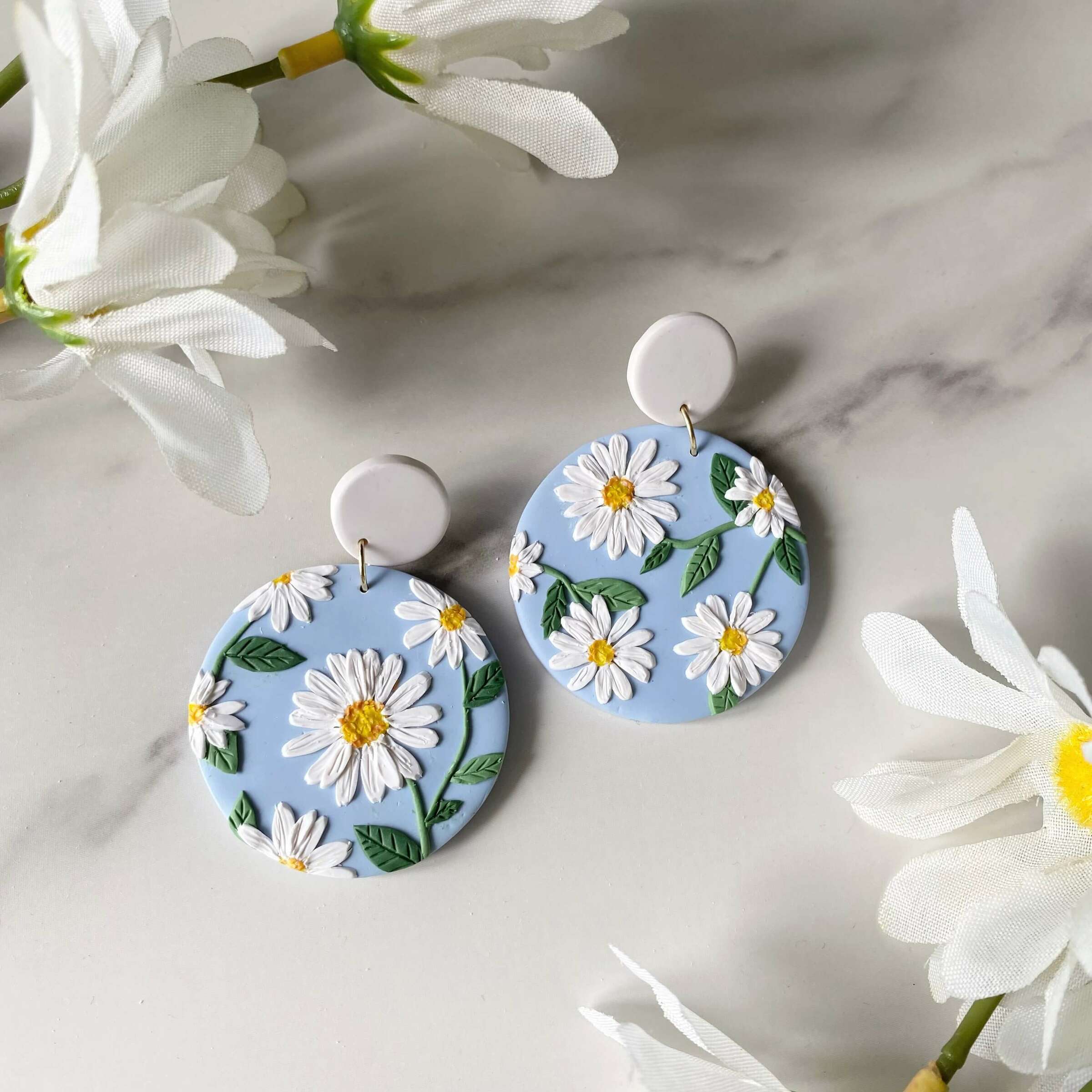 064-1 Daisy Round Statement Earrings baby blue.jpg