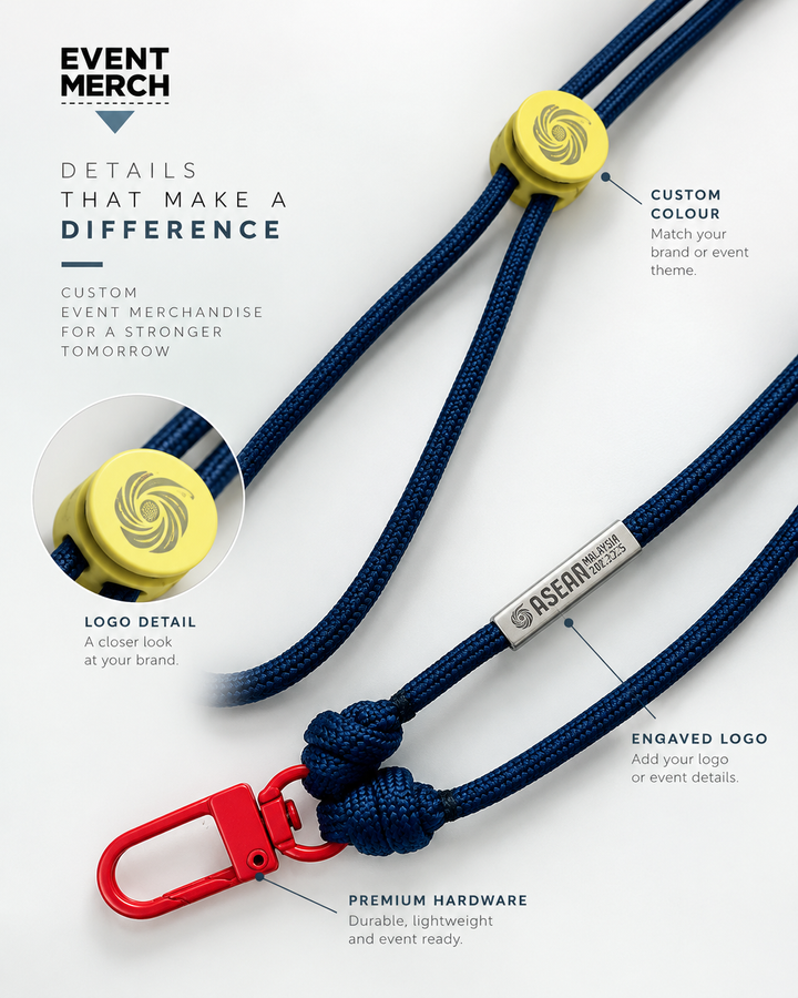 Close up of custom ASEAN logo stopper and engraved logo pendant on handmade paracord event lanyard Malaysia