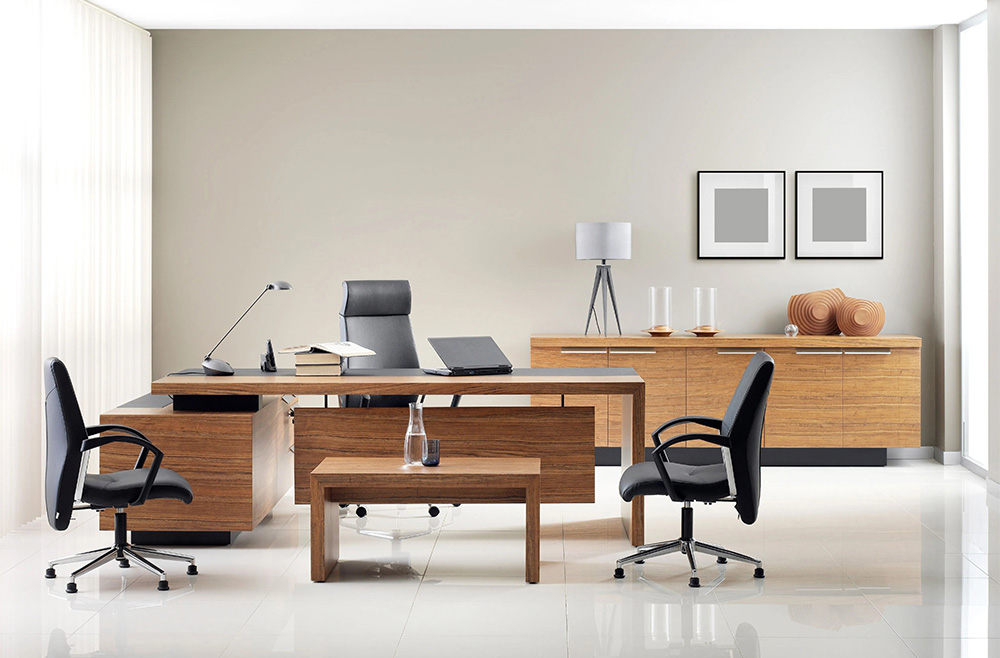 Black high back and mid back office furnitures with an L-shaped office desk