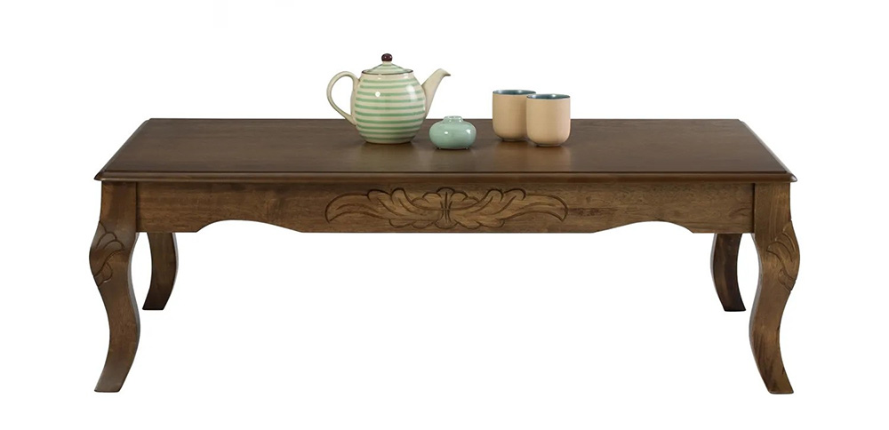 traditional french country coffee table with carved floral accents