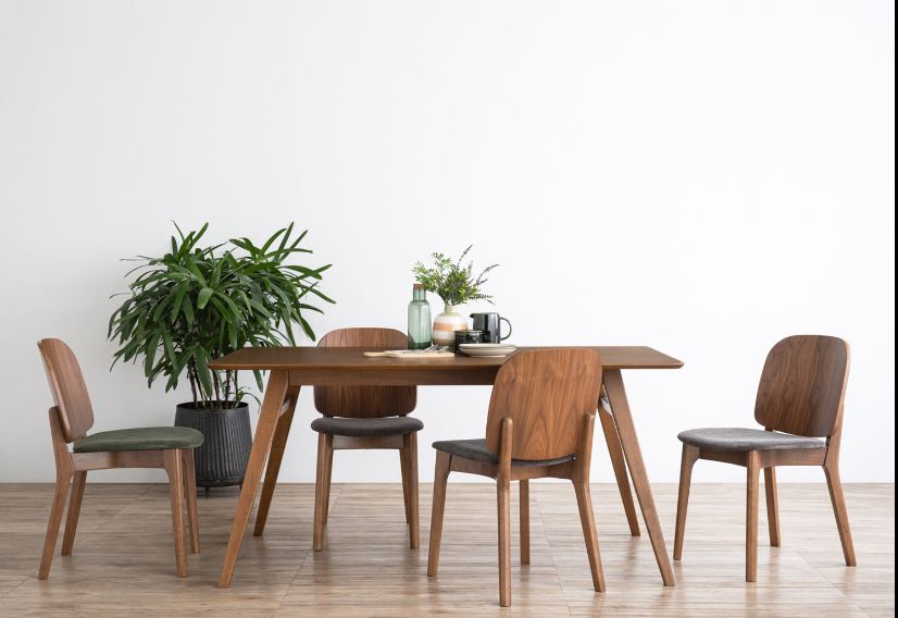 4 wooden dining chairs placed at a rectangle wooden table