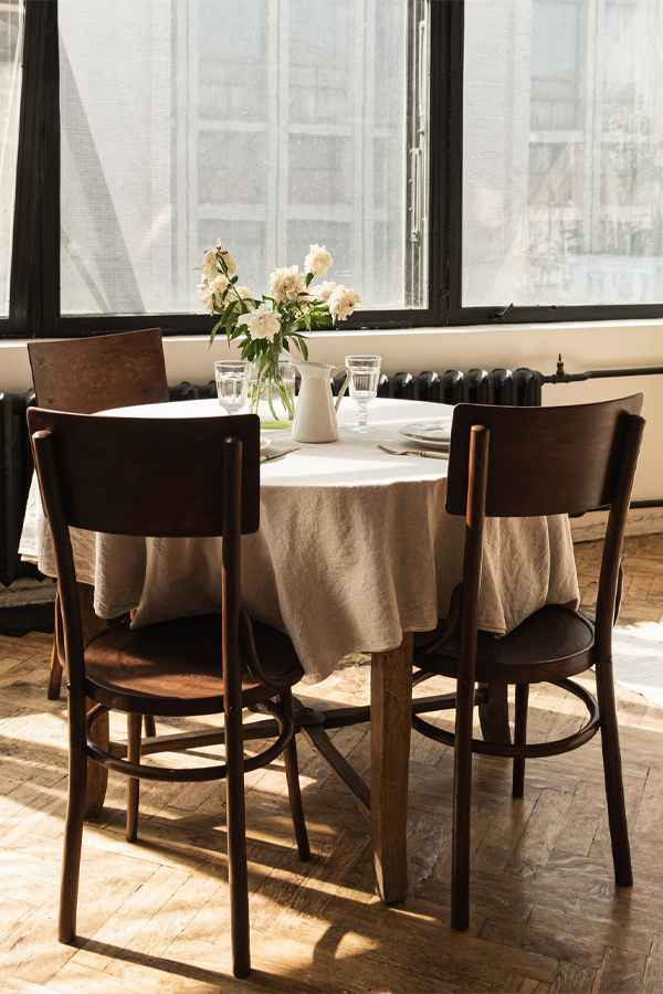 White tablecloth wood dining table