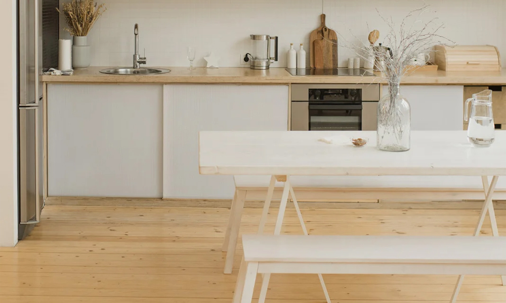 White rectangular dining table with white bench