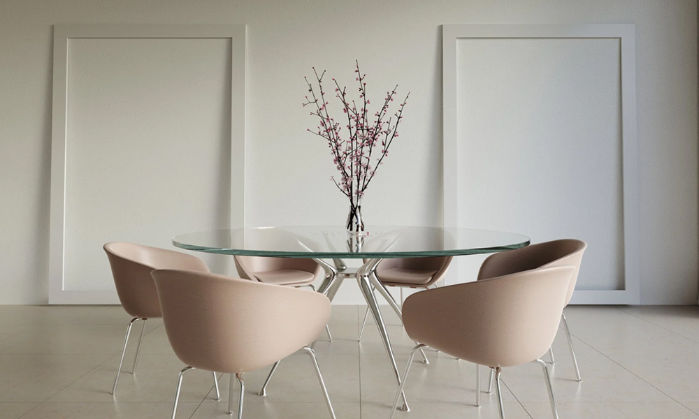 Round glass dining table with pink dining chairs