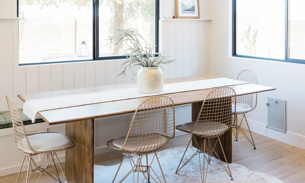 Wooden dining table with steel dining table in dining area