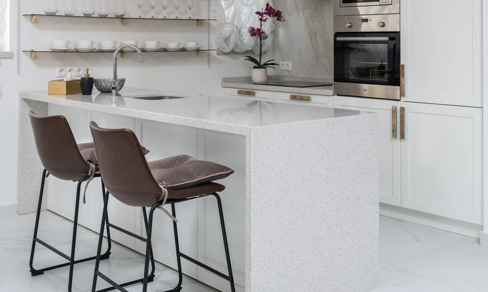 Modern bar stools in front of white counter top in minimalist kitchen design interior