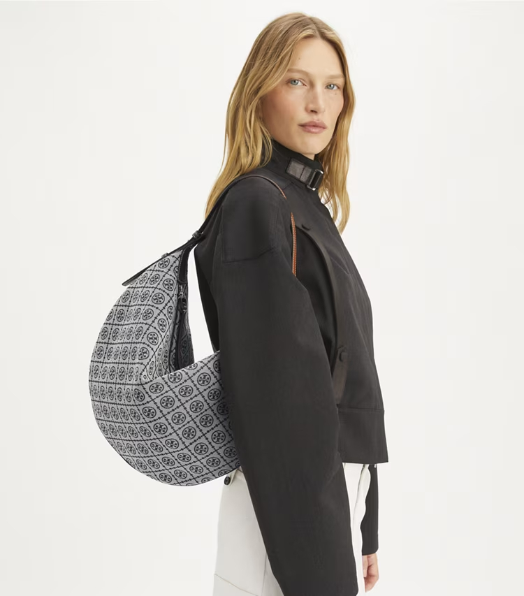 Tory Burch designer hobo bags T Monogram Balloon Bag in Tory Navy accessory on model