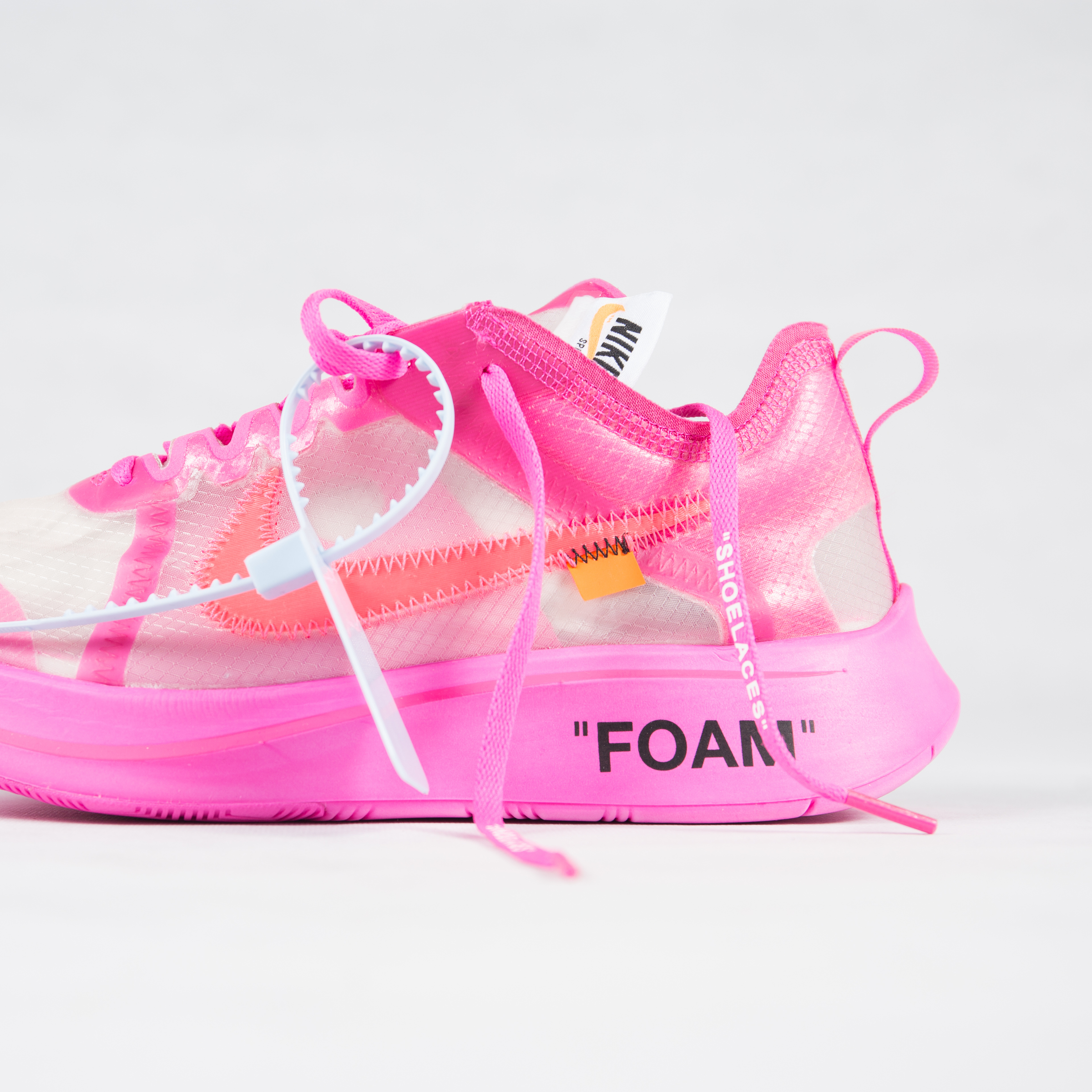 white nike with hot pink swoosh