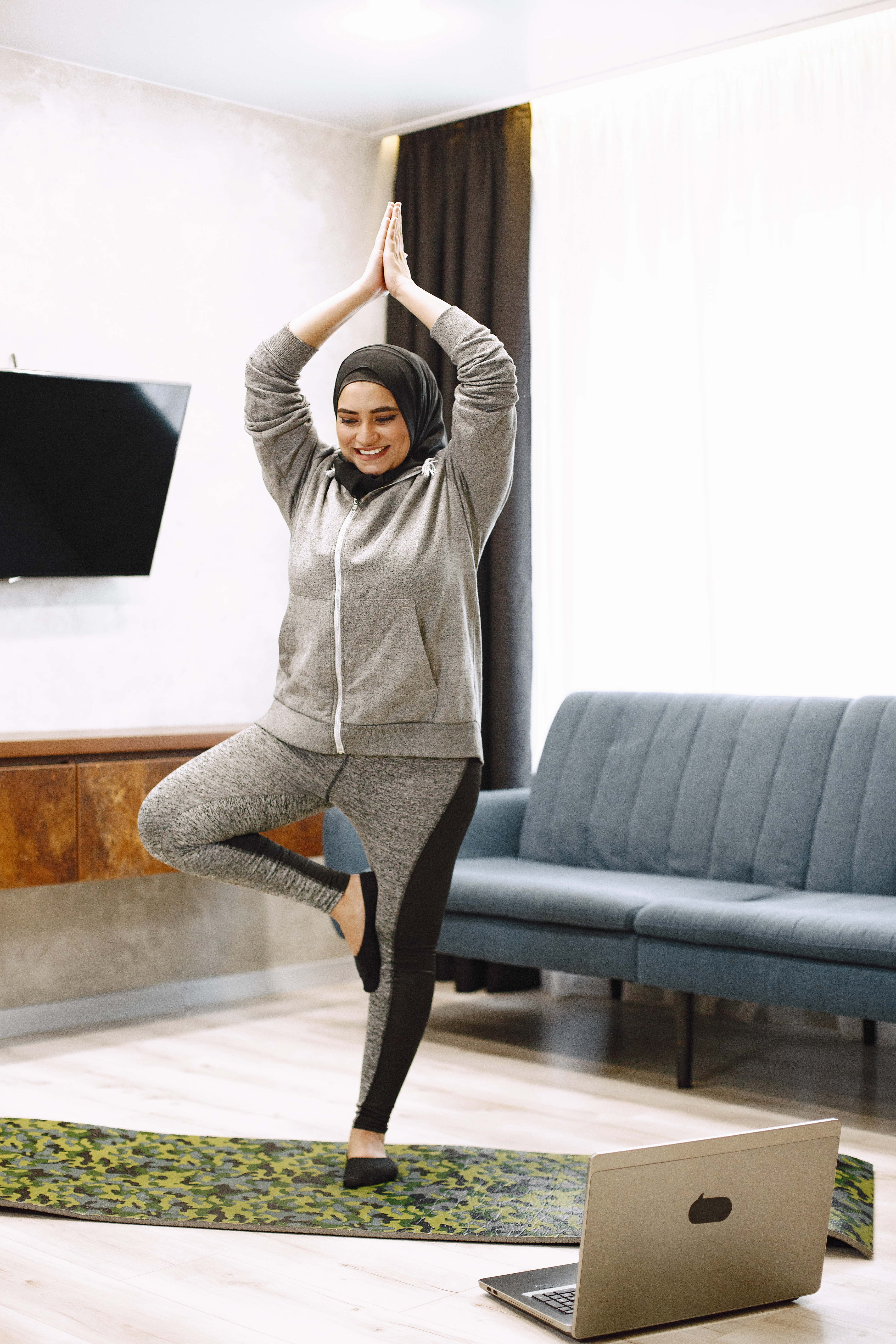 home-sport-muslim-women-smiling-arabic-girl-hijab-practicing-online-yoga-watching-video-tutorial-laptop-excersising-living-room