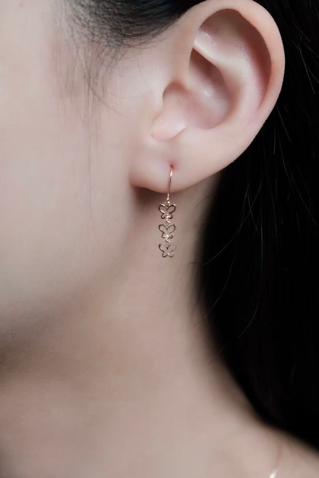 k10-butterfly-drop-earrings-wearing.jpg