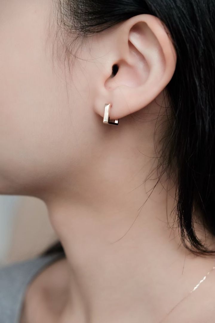 k10-square-gold-earrings-wearing.jpg