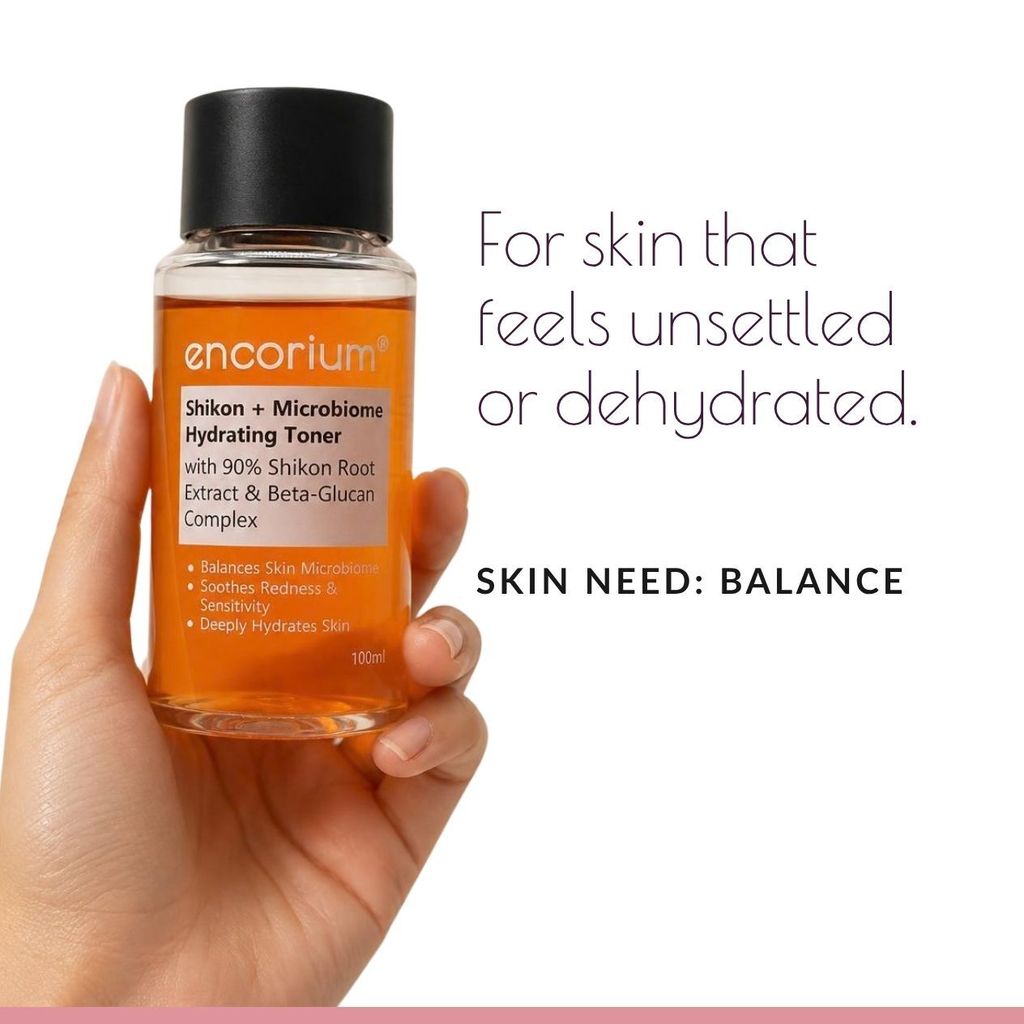 Hand holding Encorium Shikon + Microbiome Hydrating Toner. For skin that feels unsettled or dehydrated.