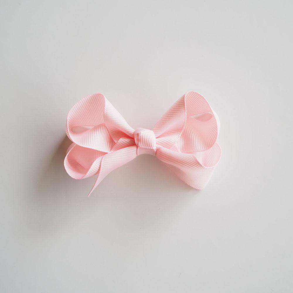 snuggle-hunny-kids-light-pink-bow-hair-clip-m_1000x.jpeg
