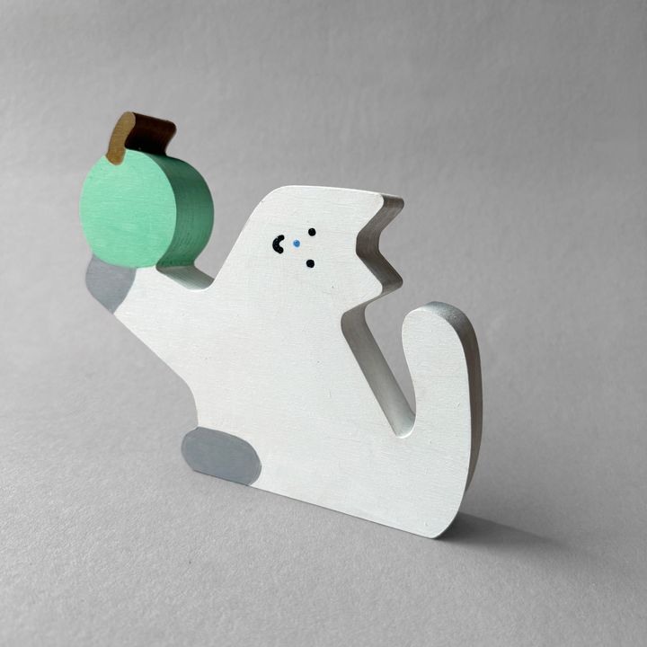 (H) Cat holding an apple