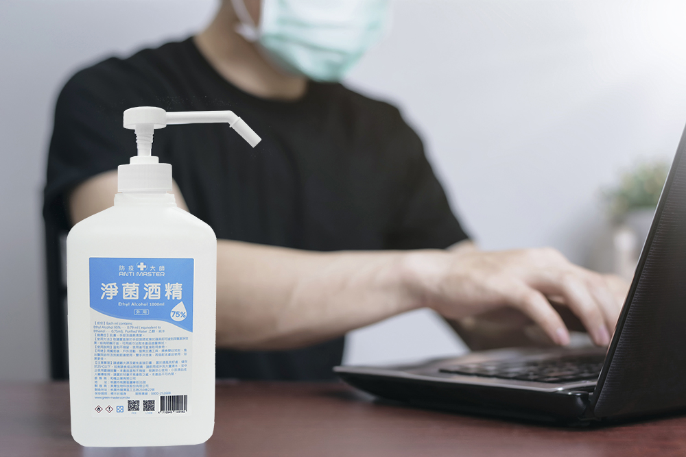 man-medical-mask-is-running-by-laptop-using-alcohol-sanitize-clean-up-her-hands.jpg