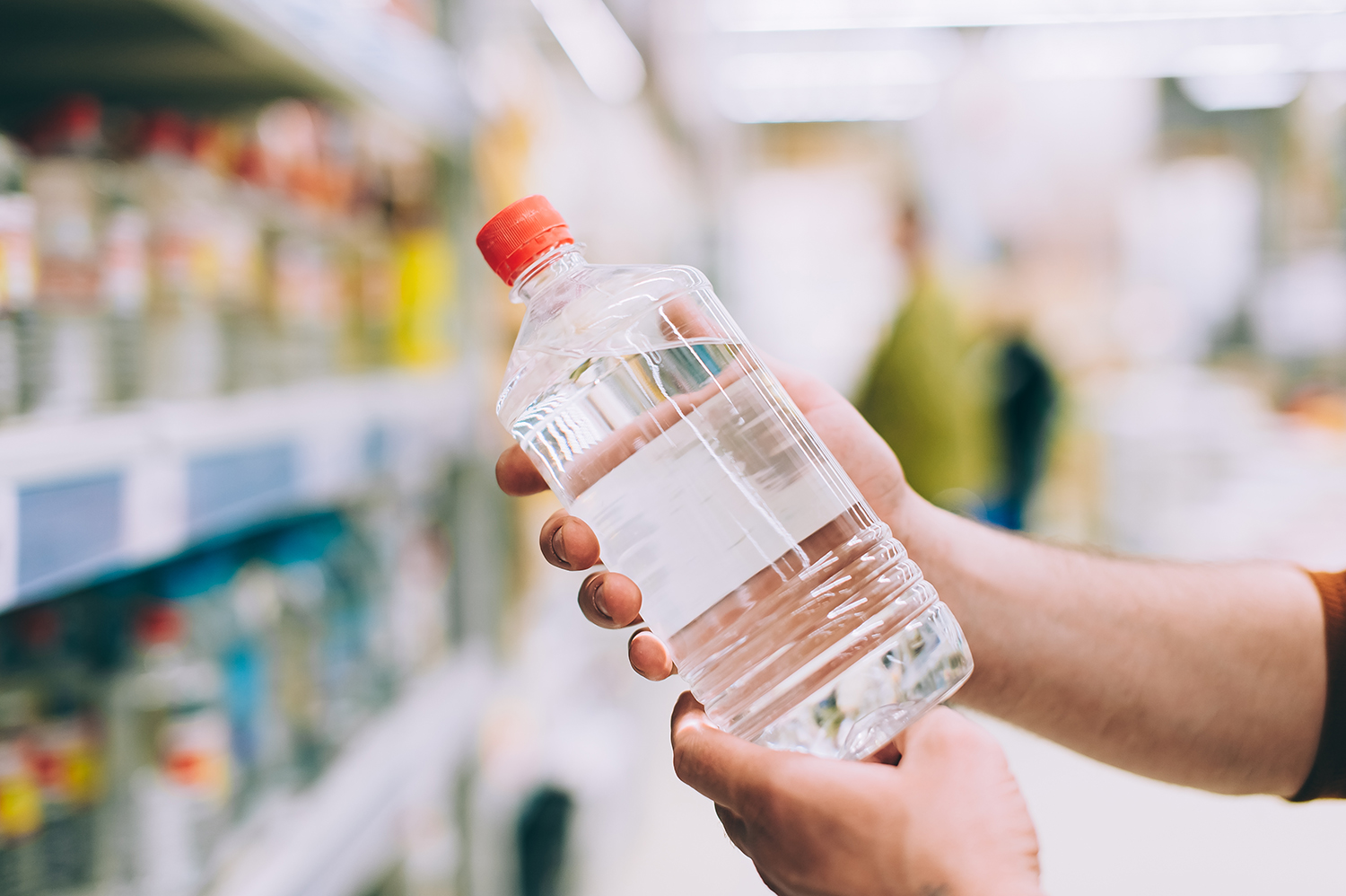 man-hardware-store-holds-bottle-solvent.jpg