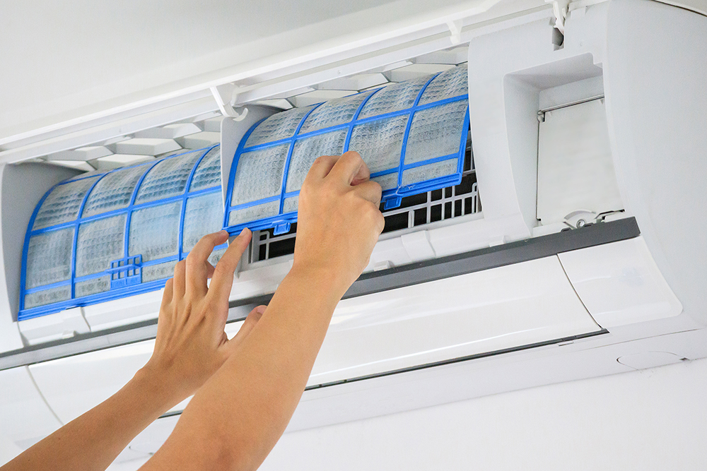 man-hand-hold-air-conditioner-filter-cleaning-concept.jpg