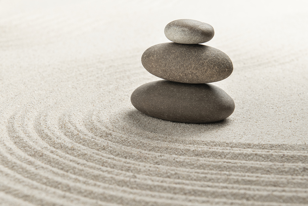 stacked-zen-stones-sand-background-art-balance-concept.jpg