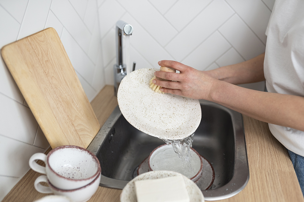 close-up-hands-washing-dishes