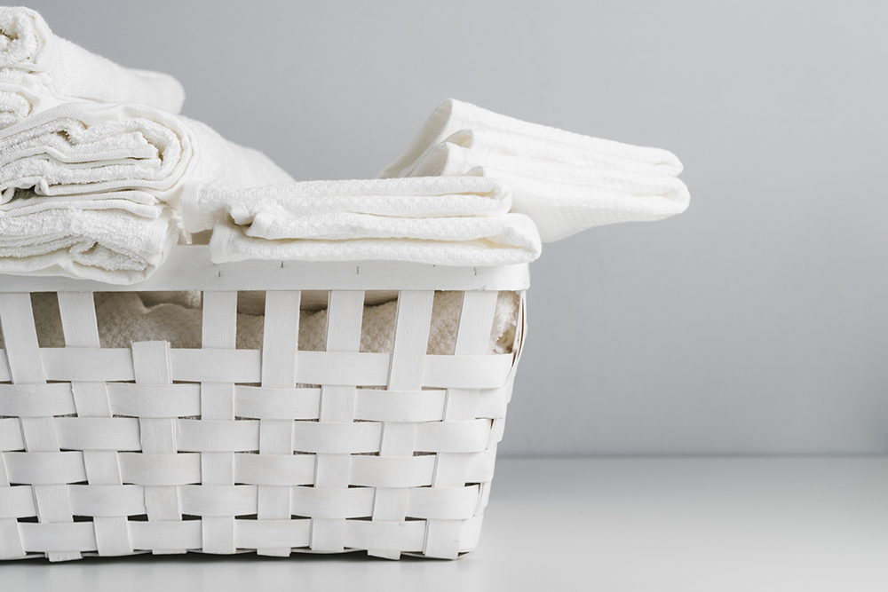 front-view-white-basket-with-towels