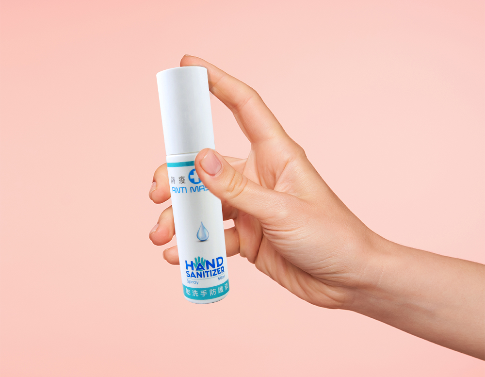 studio-photo-young-female-s-fair-skinned-hand-keeping-forefinger-button-bottle-while-going-spray-content-isolated-pink