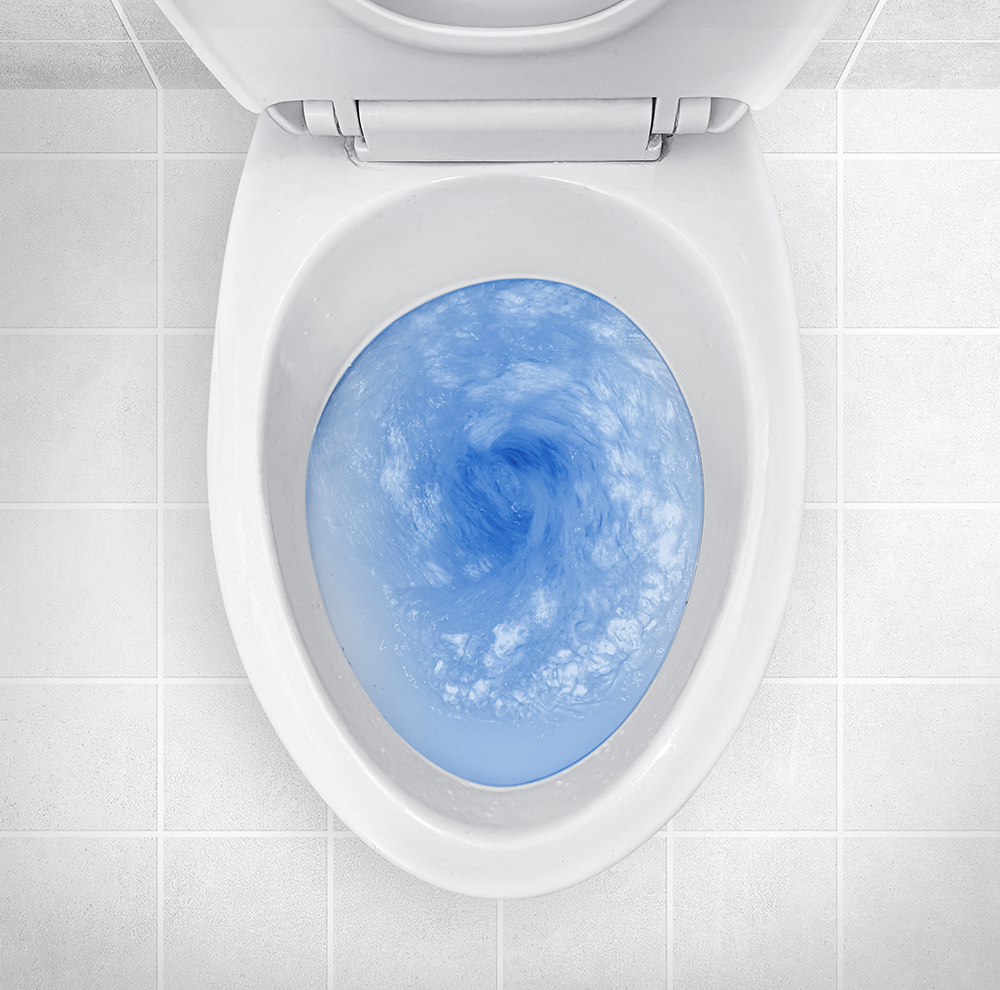 top-view-toilet-bowl-blue-detergent-flushing-it