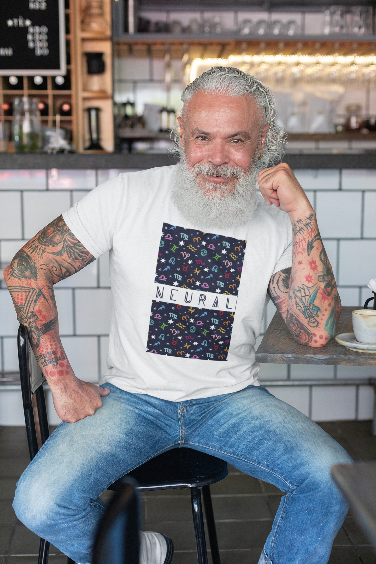 t-shirt-mockup-of-a-tattooed-man-at-a-cafe-28416.png