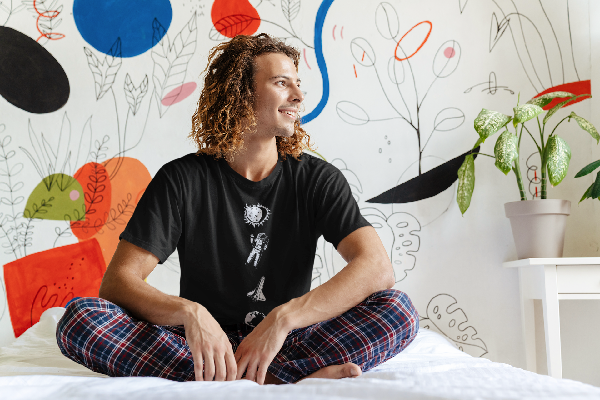 t-shirt-mockup-of-a-long-haired-man-sitting-on-his-bed-46566-r-el2.png
