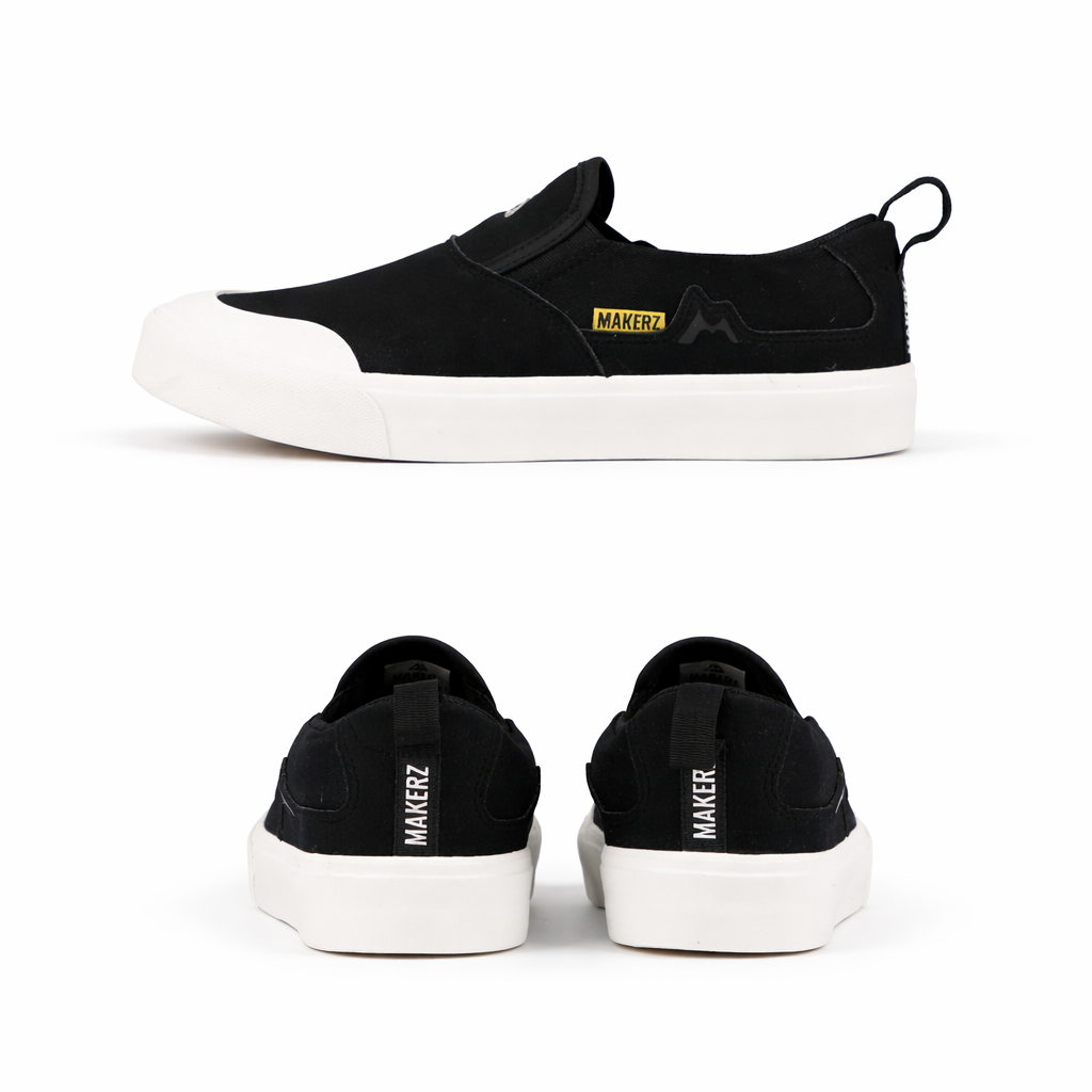 Black slip-on sneakers with _MAKERZ_ branding