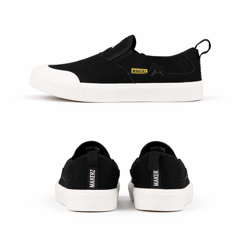 Black slip-on sneakers with _MAKERZ_ branding