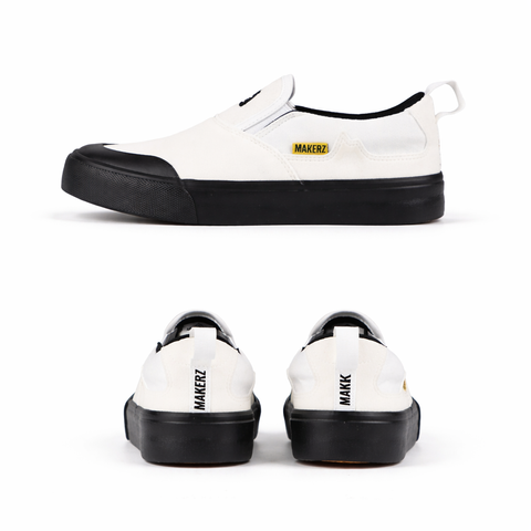 Sleek white slip-on sneakers with details