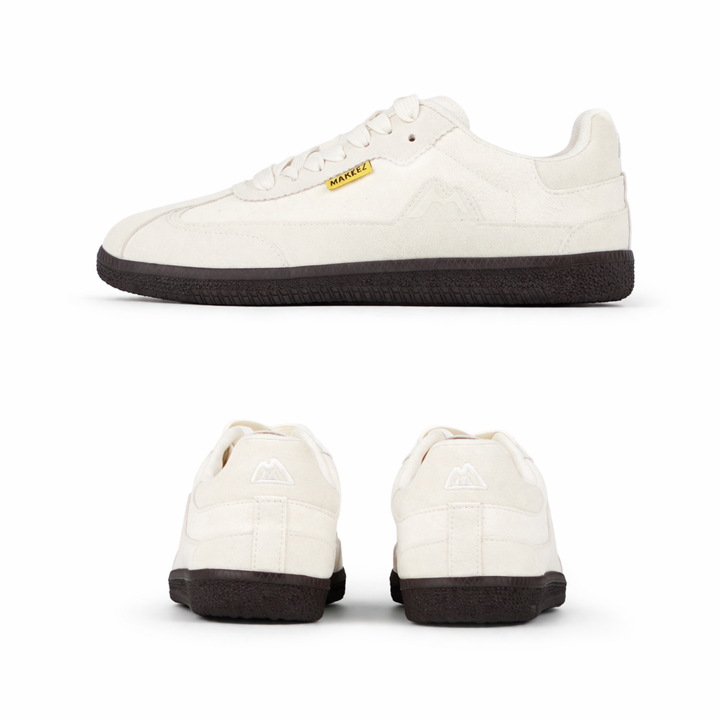 Minimalist cream sneakers in studio shot