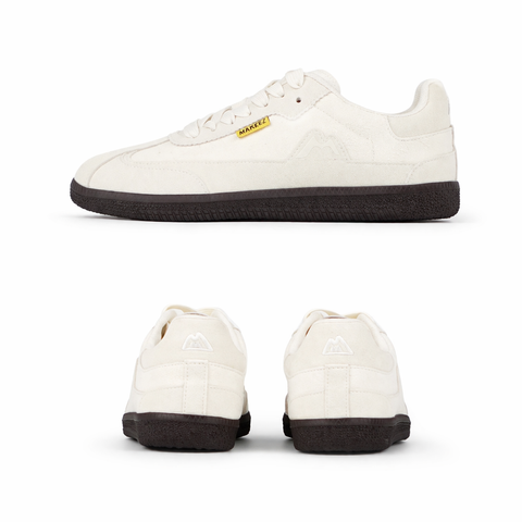 Minimalist cream sneakers in studio shot