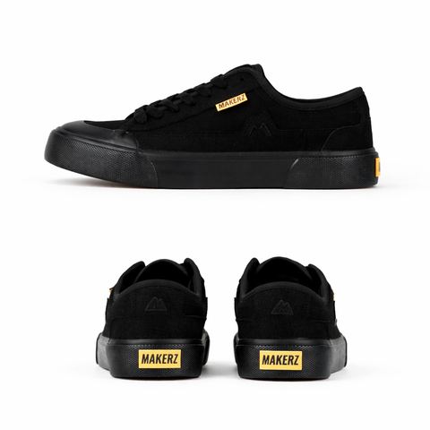 Black sneakers with yellow accents
