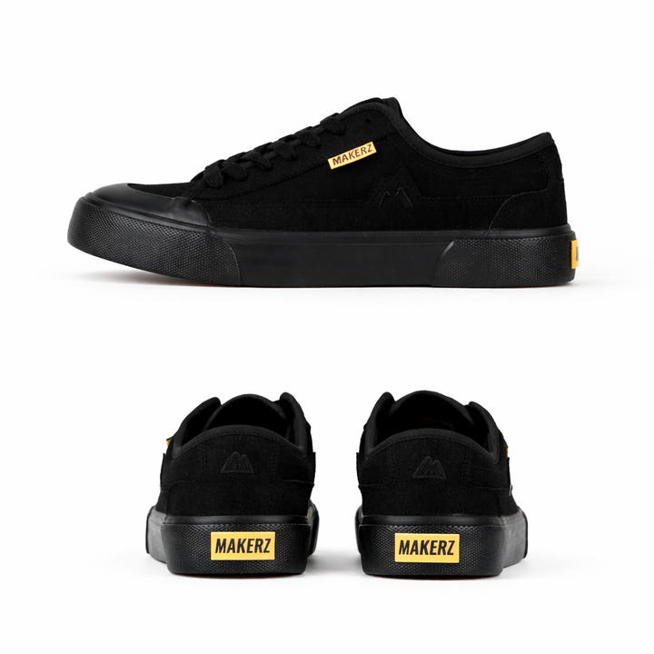 Black sneakers with yellow accents