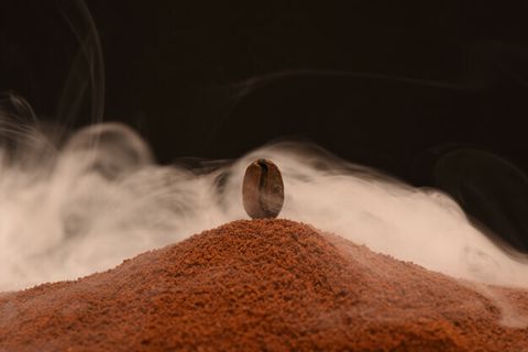 fresh-roasted-coffee-bean-stands-scattering-ground-coffee-smoke_100367-55.jpg