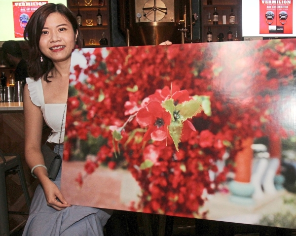 Pink Yap with her work, ‘Faith’. — Photos: SHAARI CHEMAT/The Star