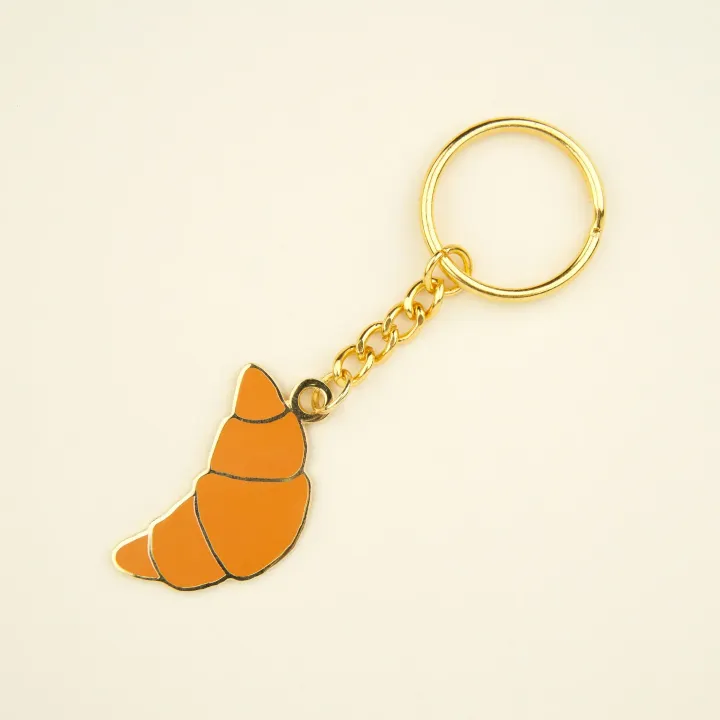 coucou-suzette-accessoire-accessory-cadeau-gift-tendance-mode-trendy-fashion-douce-france-french-frenchy-porte-cles-key-ring-croissant-beige-golden-dore