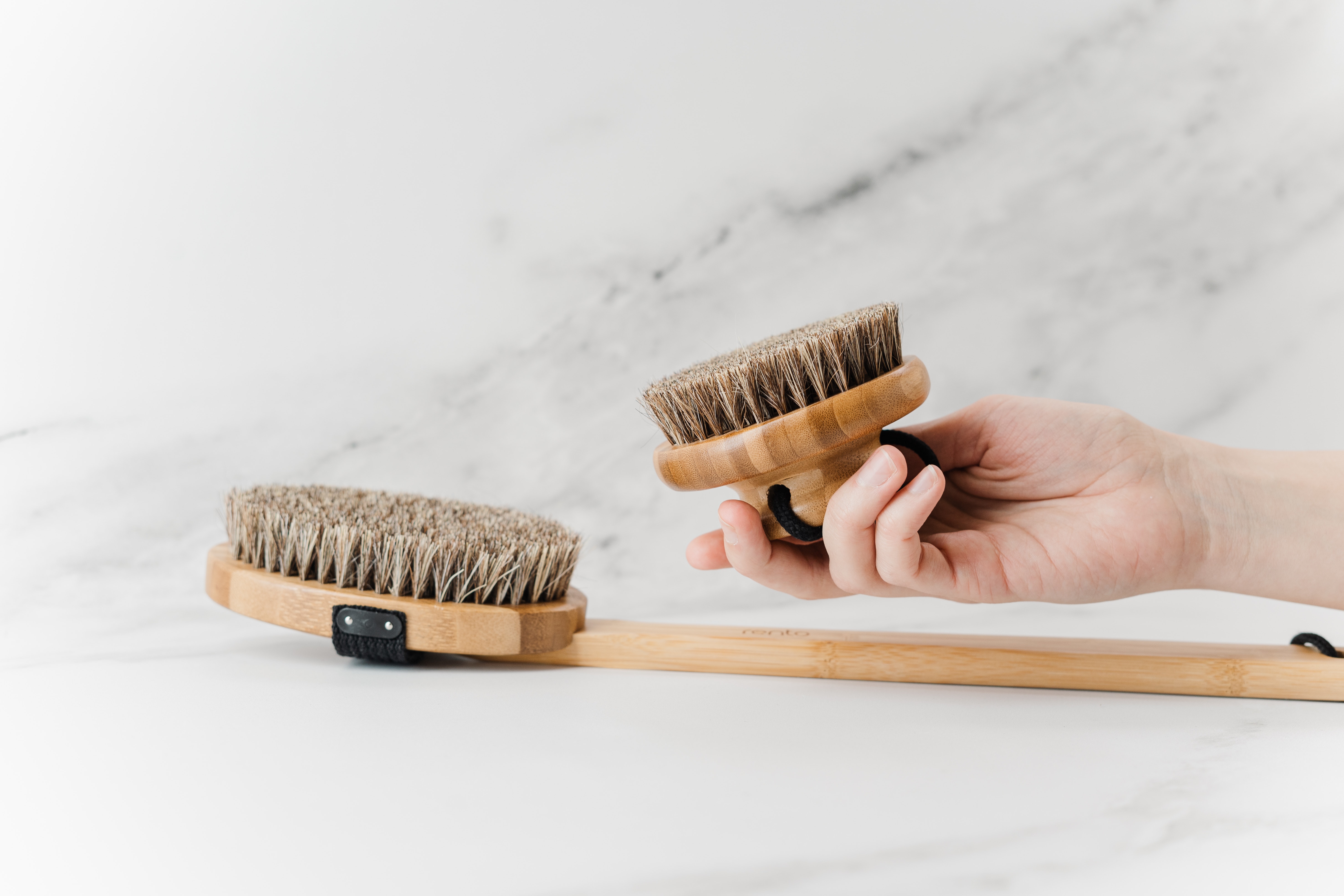 person-holding-brown-wooden-brush-3737606.jpg