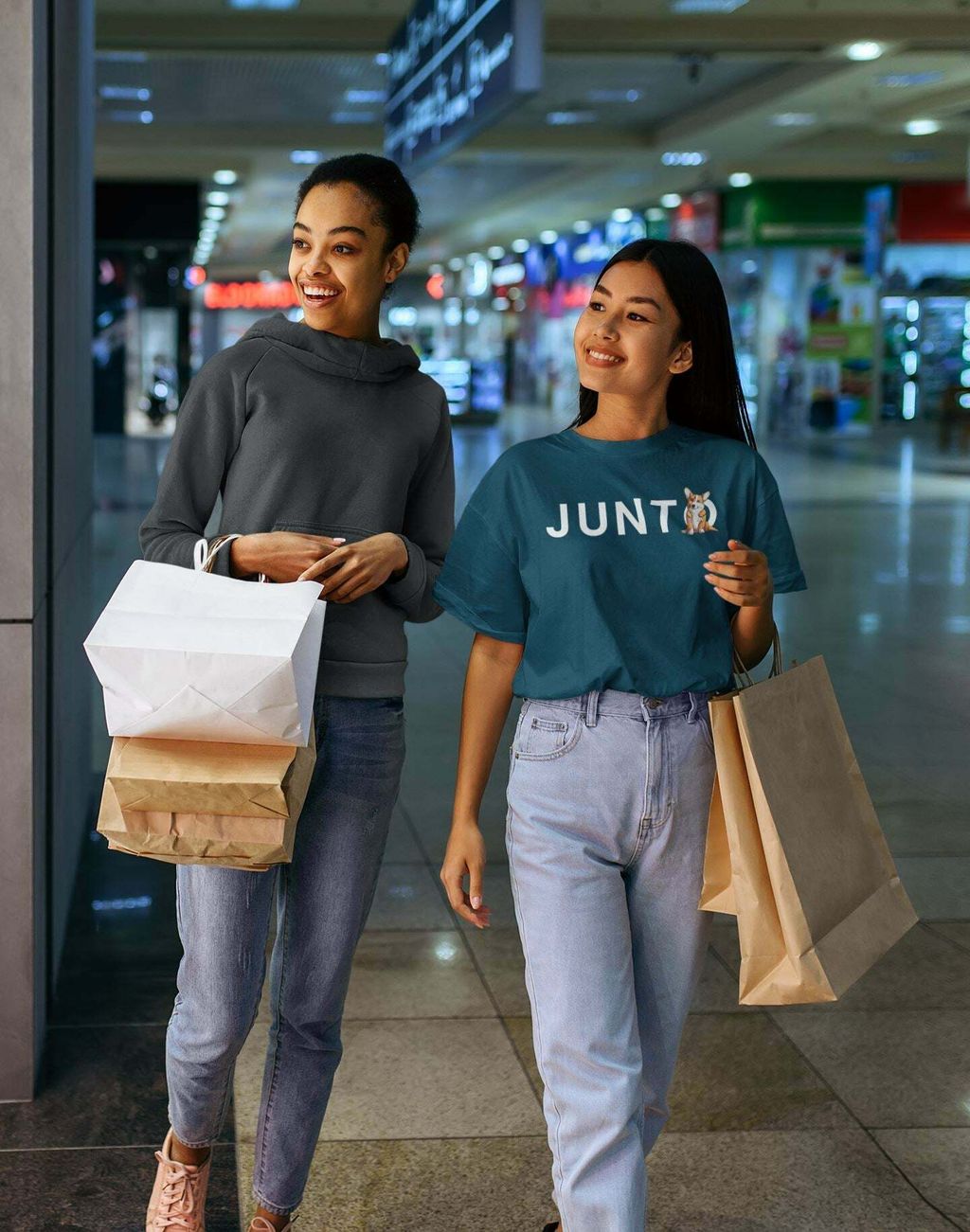 t-shirt-and-hoodie-mockup-of-two-female-friends-shopping-at-a-mall-44401-r-el2