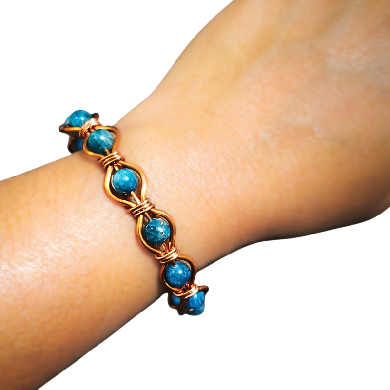 Radiant Twist Copper Bangle featuring Gemstones